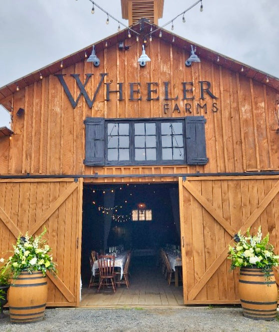 Wedding: Whiskey Barrel Arrangements for the Ceremony