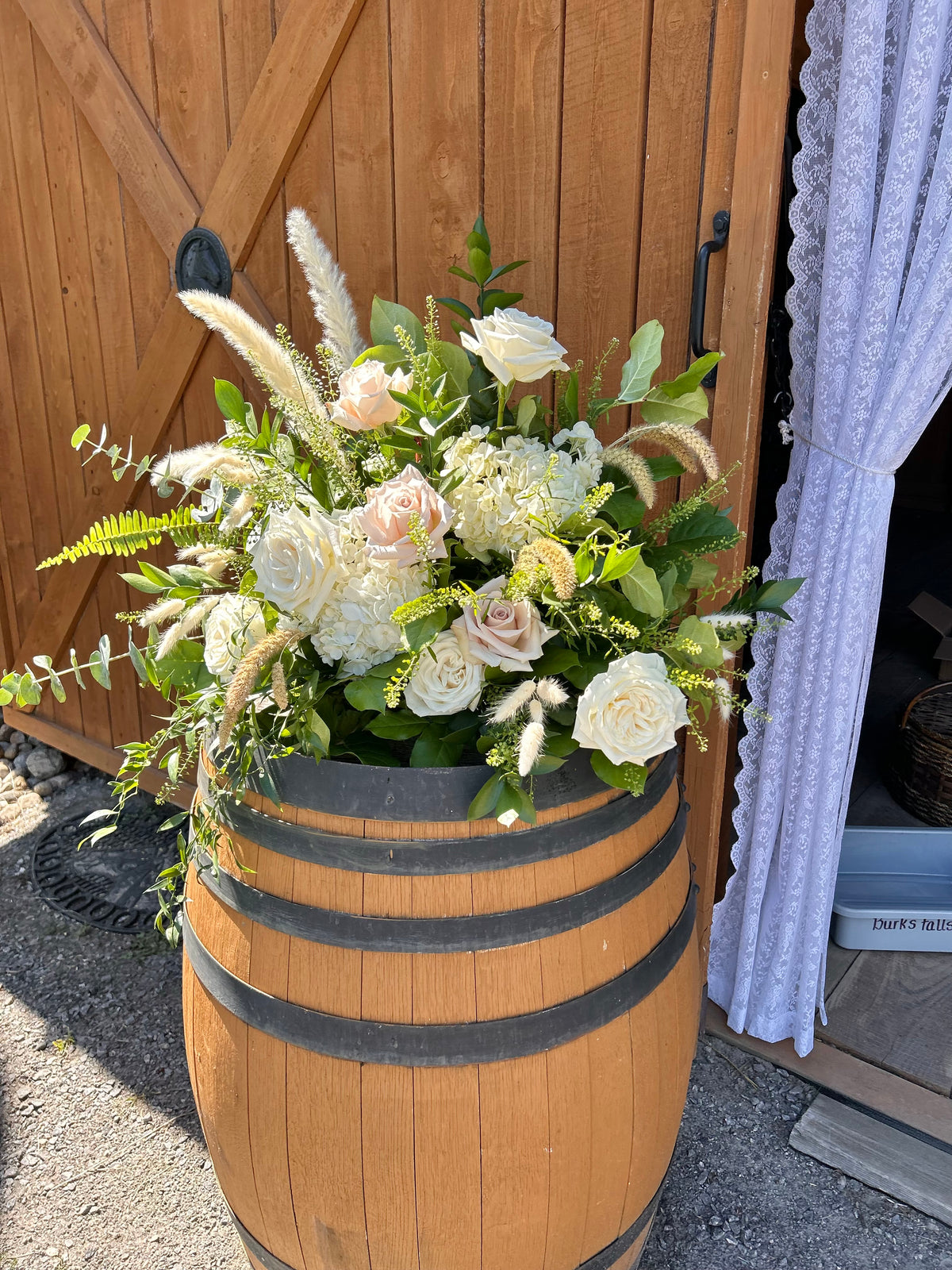Wedding: Whiskey Barrel Arrangements for the Ceremony