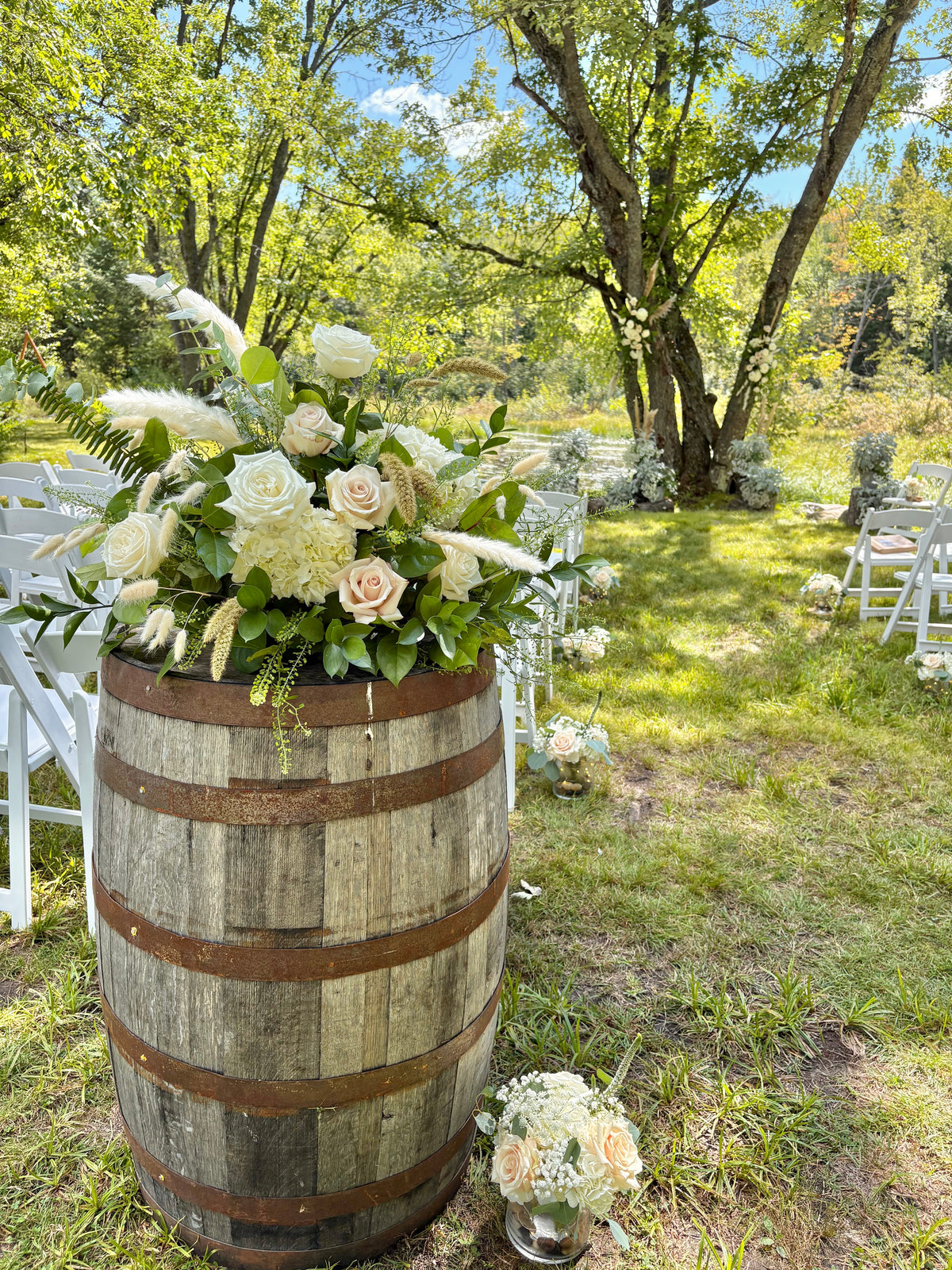 Wedding: Whiskey Barrel Arrangements for the Ceremony